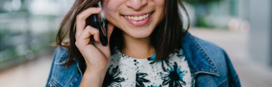 woman talking on her cellphone and smiling